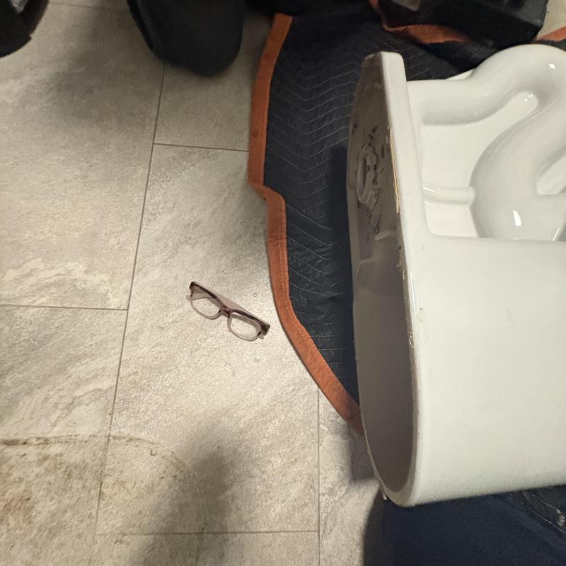 Toilet removed on tiled floor with protective mat Toilet removed on tiled floor with protective mat