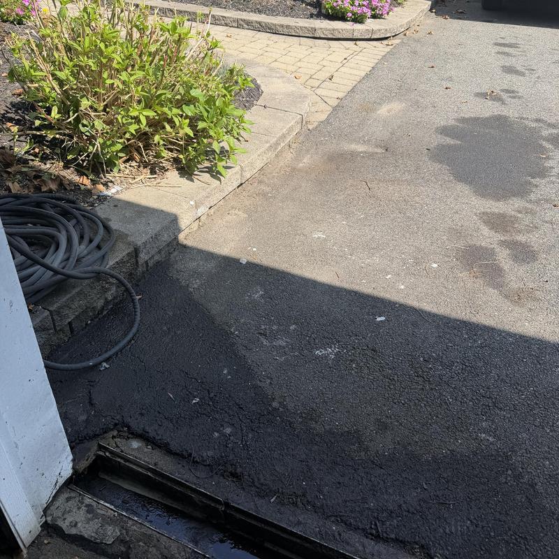 Main line drain with driveway and hose nearby Main line drain with driveway and hose nearby