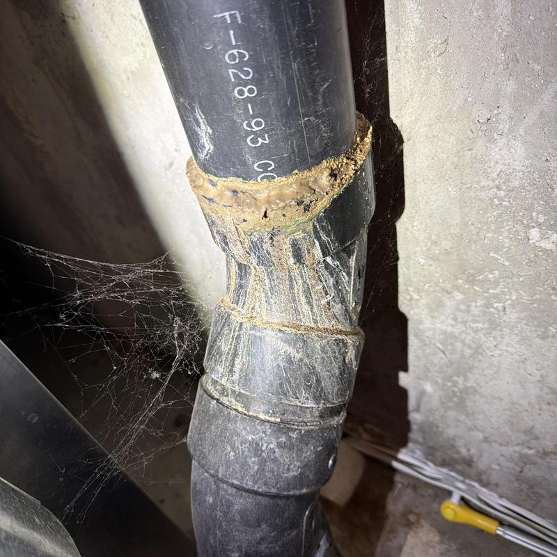 Main stack waste pipe with glue residue and cobwebs