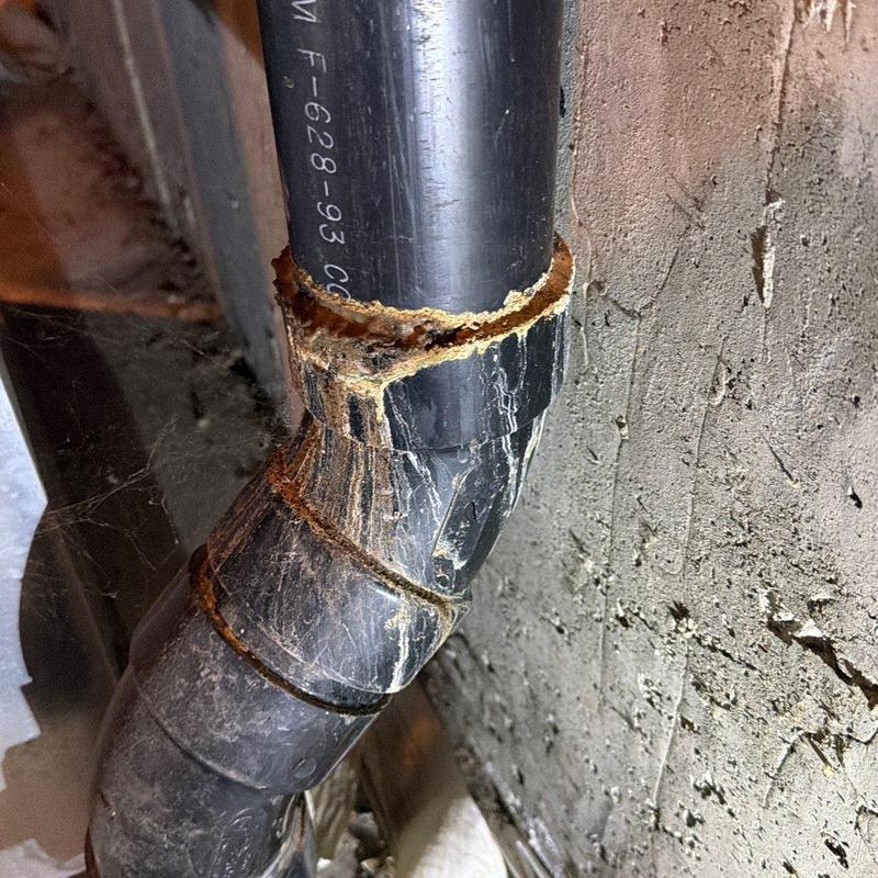 Main stack waste line PVC pipe with corrosion buildup