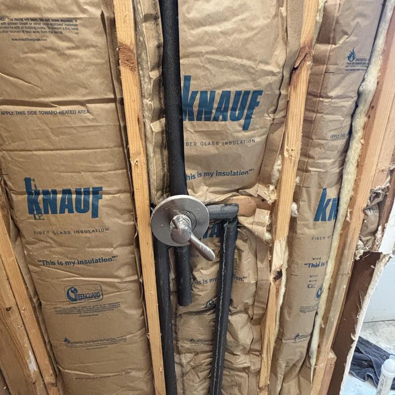 Shower valve rough-in with insulation in wall cavity Shower valve rough-in with insulation in wall cavity