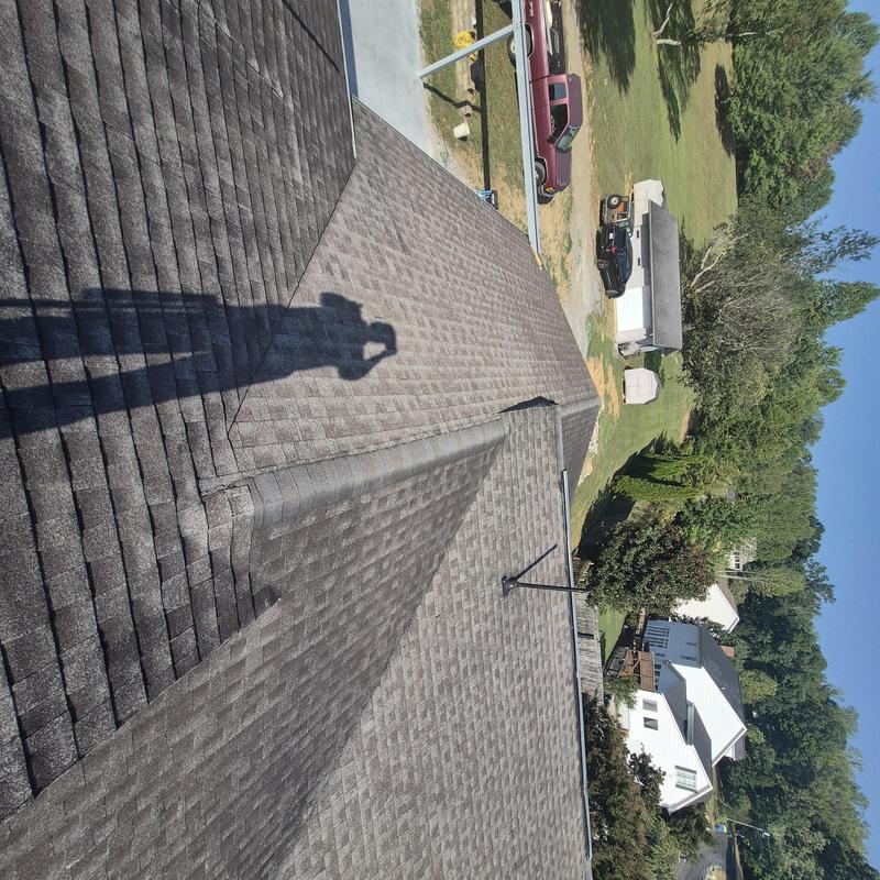 Asphalt shingle roof inspection with visible wear and damage Asphalt shingle roof inspection with visible wear and damage