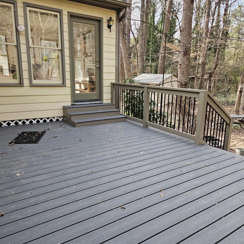 Composite deck with gray railing and steps