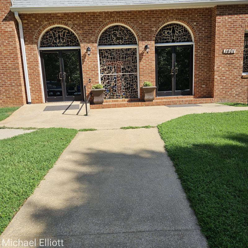 Concrete sidewalk and egress improvements at brick church entrance