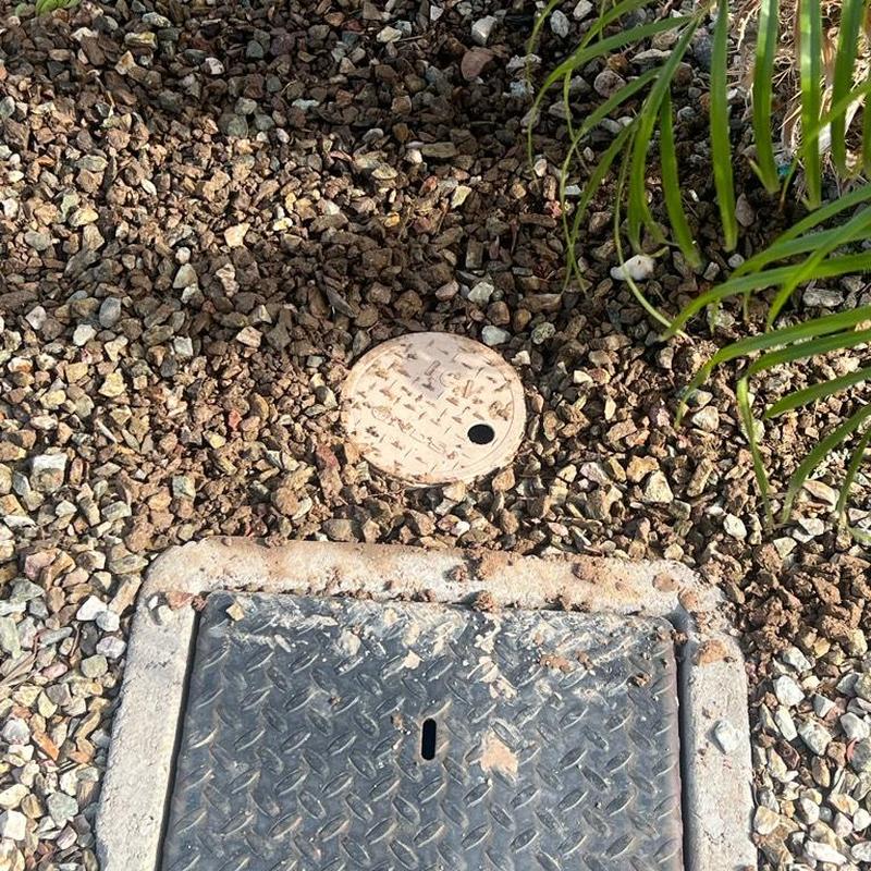 Pressure regulator valve with landscaping cover box installed