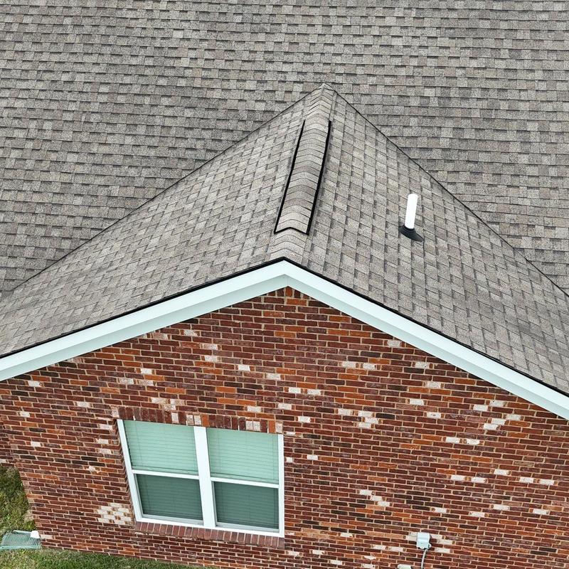 Asphalt shingle roof with hail damage and flashing inspection