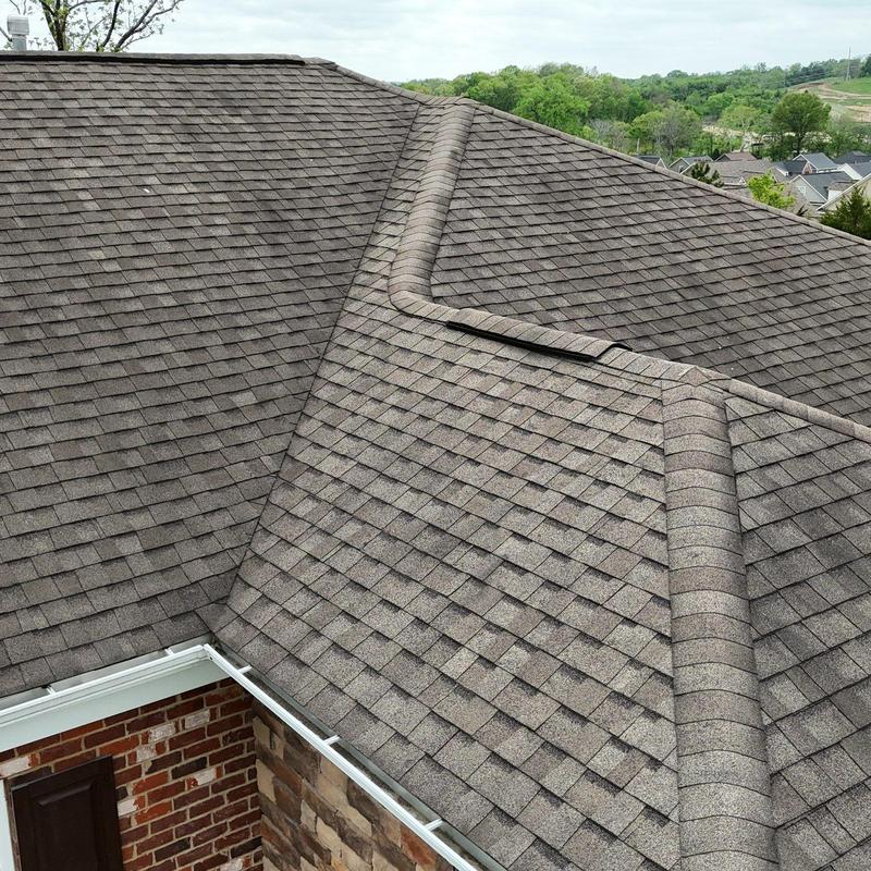 Asphalt shingle roof with hail damage inspection