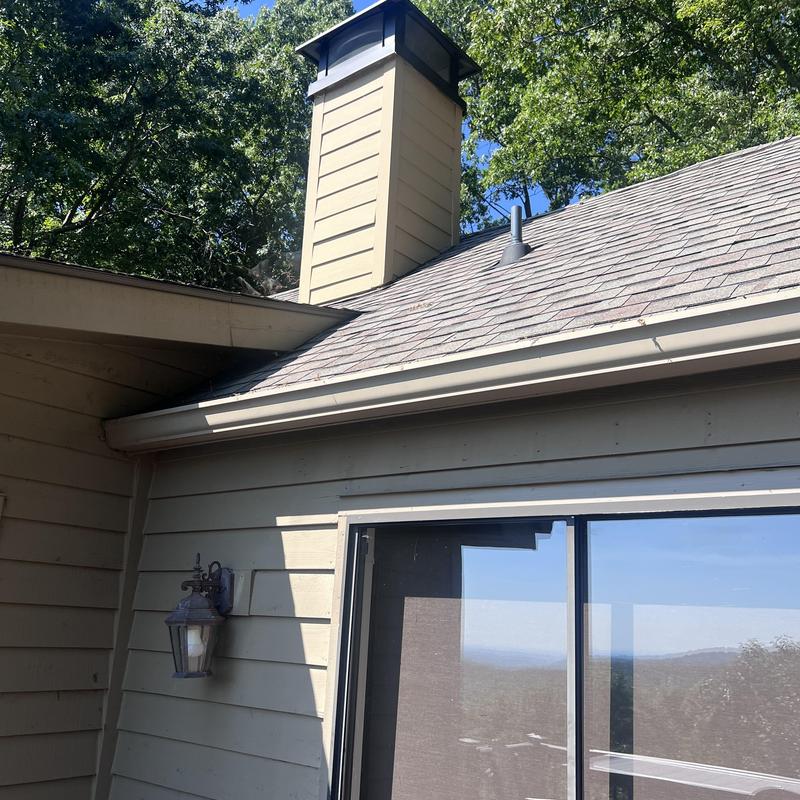 Chimney chase with custom cap and exterior siding repairs