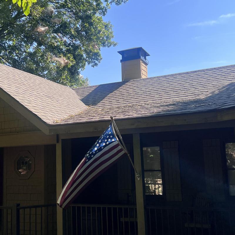 Custom chimney cap and shroud on roof repair