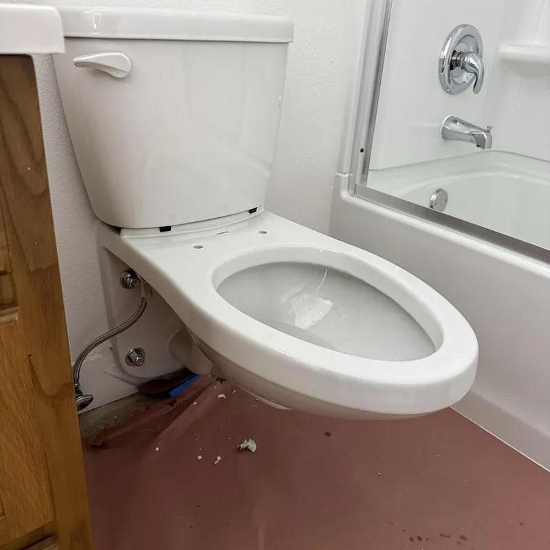 Toilet installation with flange seal and caulk around base Toilet installation with flange seal and caulk around base