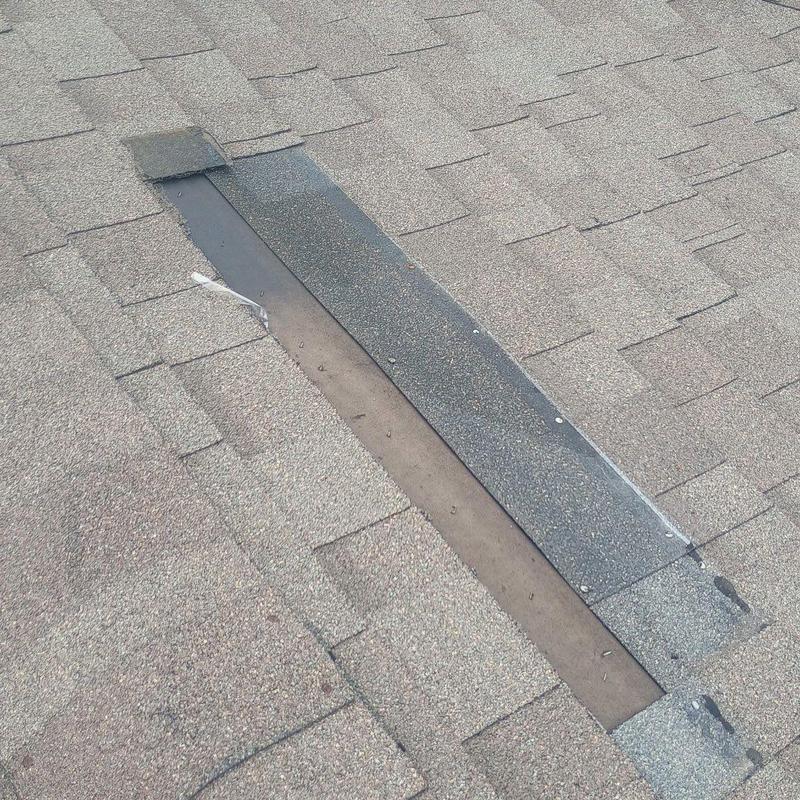 Roof shingles with missing and damaged strip section