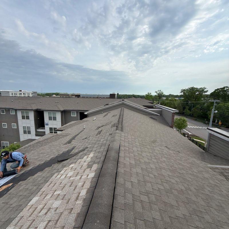 Asphalt shingle roof with hail damage inspection