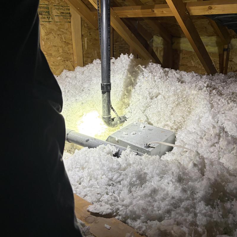Shower vent pipe with glued ABS coupling in attic insulation