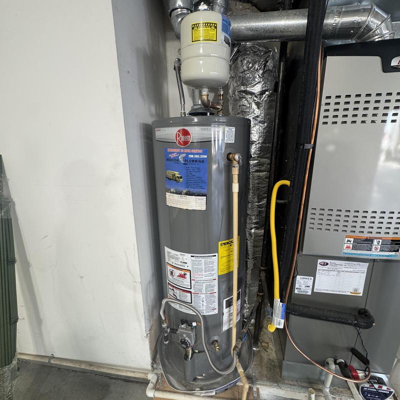Water heater with expansion tank and fittings installed