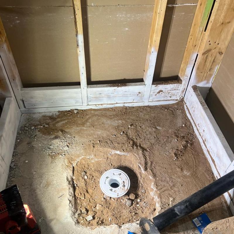Shower drain installation with concrete removal Shower drain installation with concrete removal
