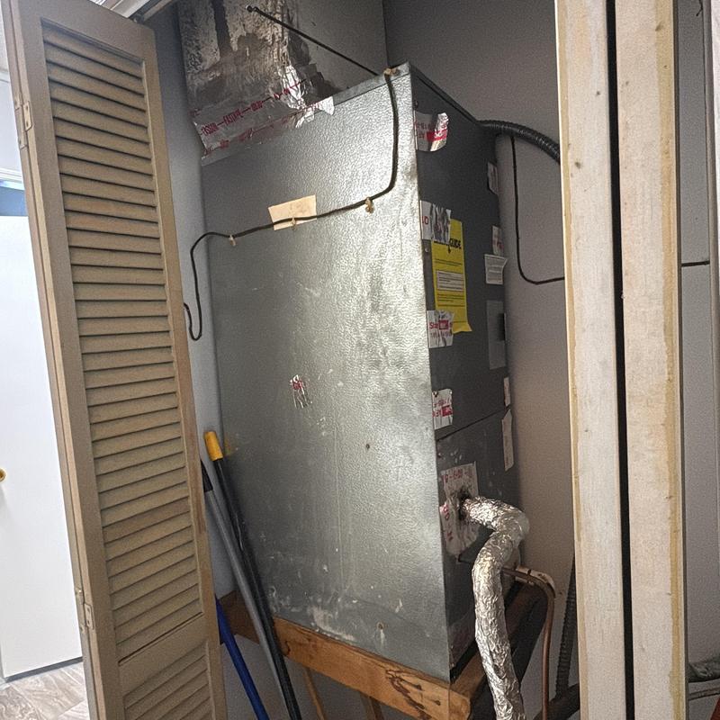 Air handler unit in small utility closet Air handler unit in small utility closet