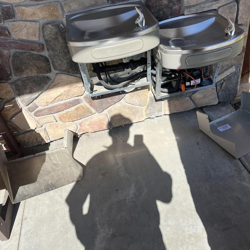 Drinking fountain winterization setup on stone wall