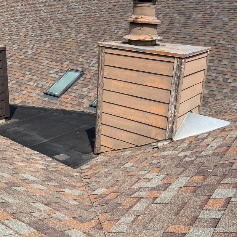 Roof chimney flashing with impact resistant shingles Roof chimney flashing with impact resistant shingles