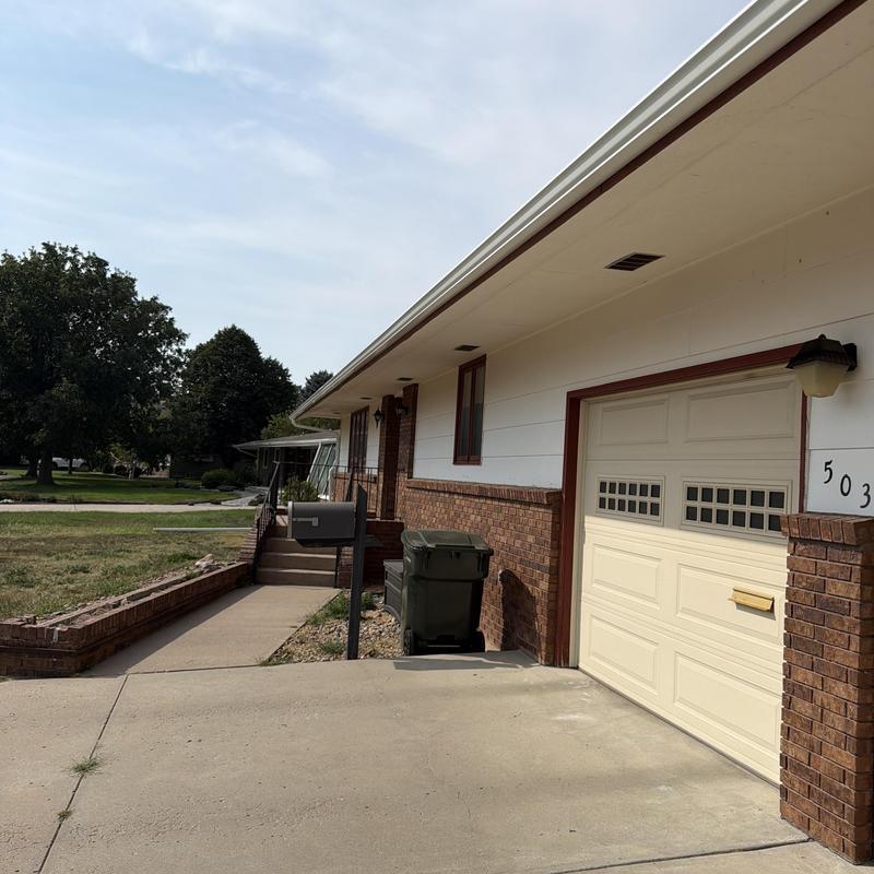 Aluminum gutters on residential house exterior Aluminum gutters on residential house exterior