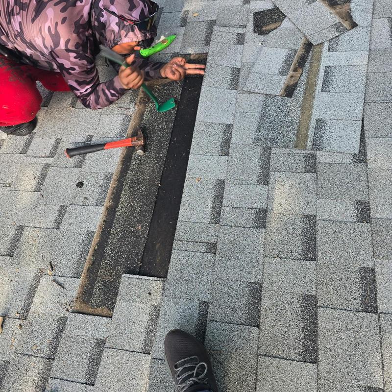 Asphalt roof shingles repair with tools on roof Asphalt roof shingles repair with tools on roof