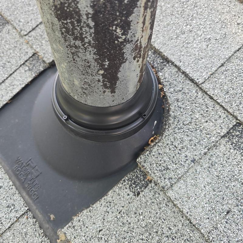 Roof vent pipe flashing with sealant on shingles Roof vent pipe flashing with sealant on shingles