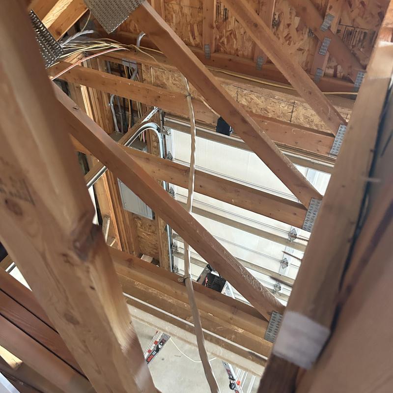 Electrical wiring installation in attic framing Electrical wiring installation in attic framing