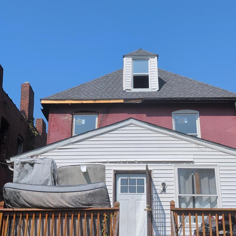 Roof edge and gutter damage on residential home in Fenton