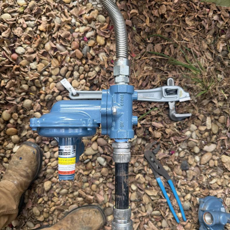 Gas regulator installation on outdoor piping system