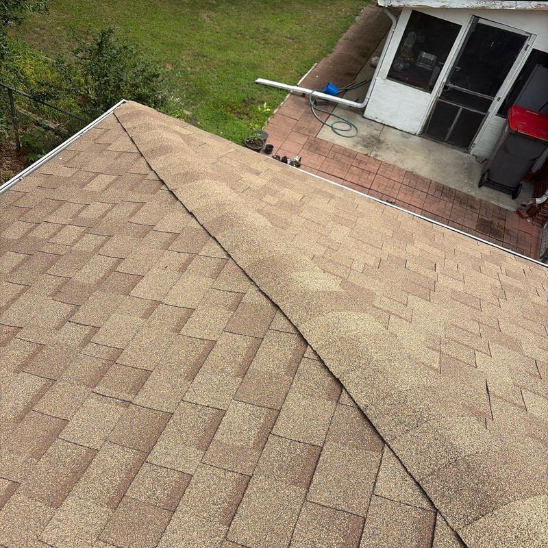 IKO Cambridge AR shingles on residential roof ridge IKO Cambridge AR shingles on residential roof ridge