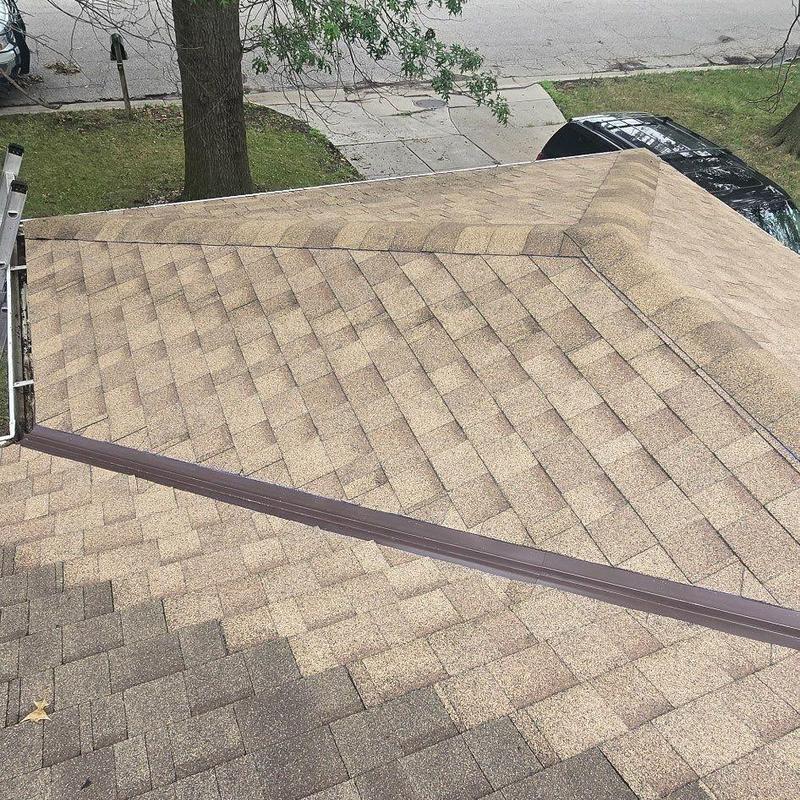 IKO Cambridge AR Class 3 shingles on rooftop ridge IKO Cambridge AR Class 3 shingles on rooftop ridge