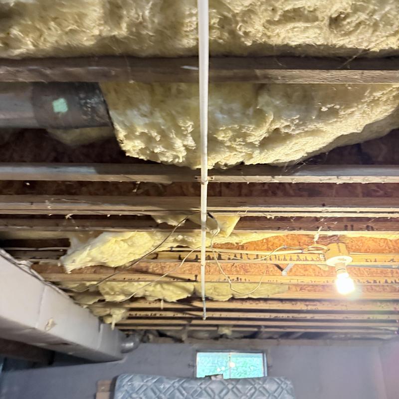 PEX water piping installed on basement ceiling joists PEX water piping installed on basement ceiling joists