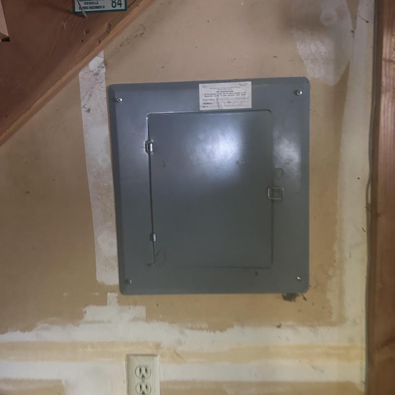 Electrical panel box installed in basement wall