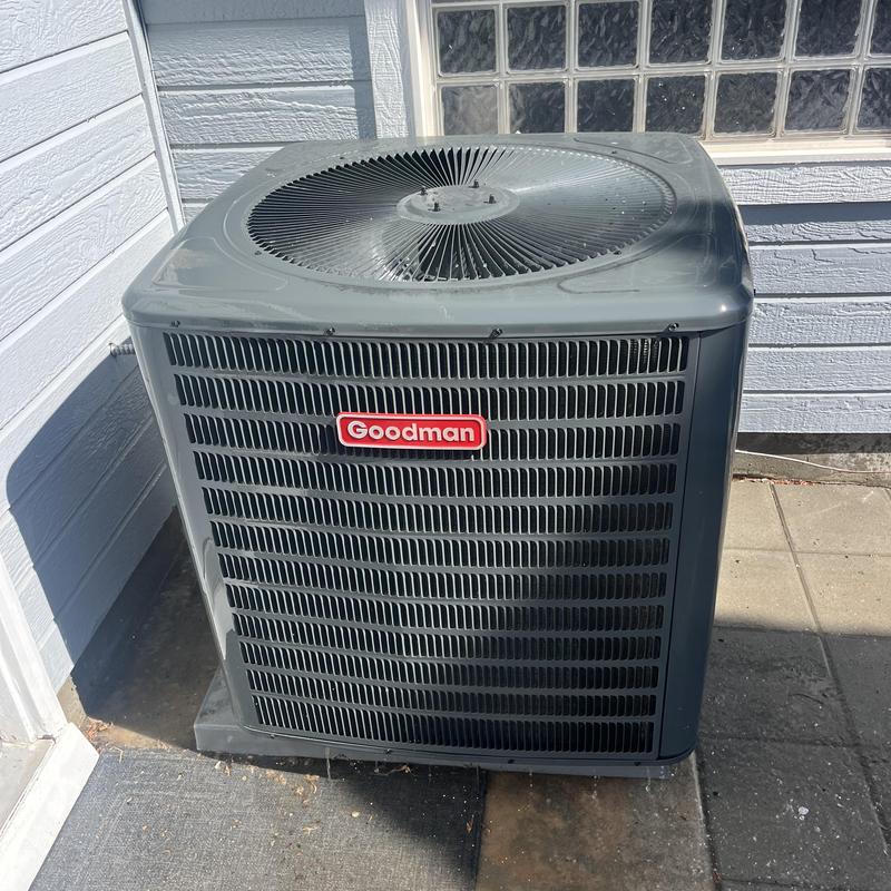Goodman outdoor air conditioner unit on concrete pad Goodman outdoor air conditioner unit on concrete pad