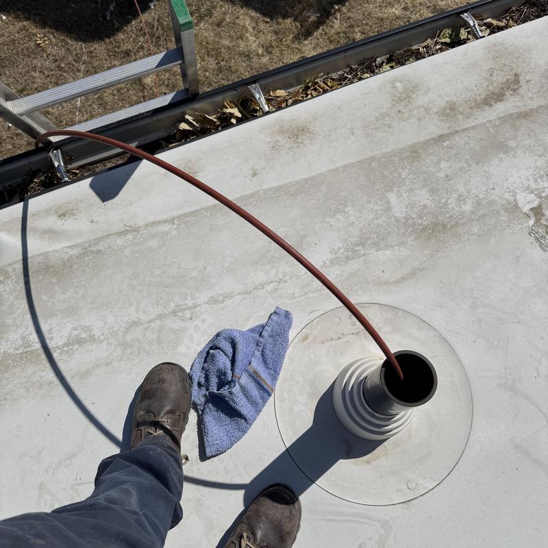 Roof pipe flashing with drain snake cable and boots Roof pipe flashing with drain snake cable and boots