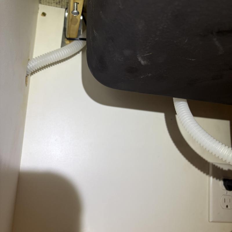 Dishwasher drain hose with raised loop under sink Dishwasher drain hose with raised loop under sink