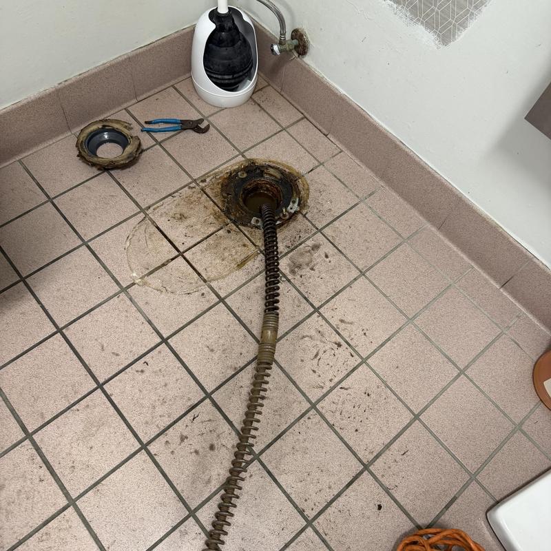 Commercial floor drain with cleaning tools and hose Commercial floor drain with cleaning tools and hose