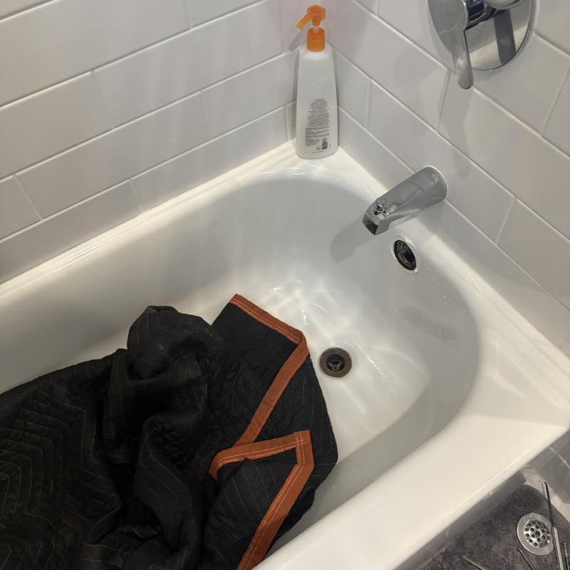 Bathtub faucet and drain with protective covering Bathtub faucet and drain with protective covering