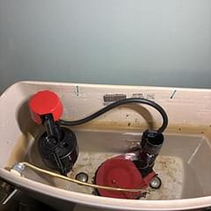 Toilet tank fill and flush valve assembly inside tank