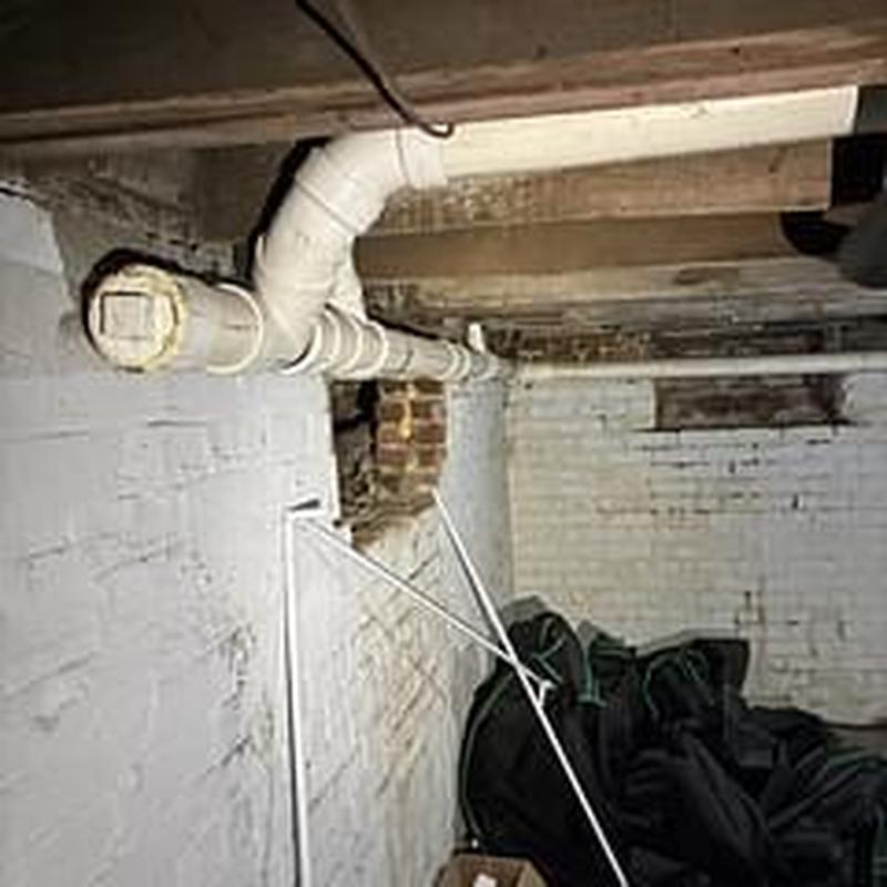 Main sewer line pipe in basement crawl space