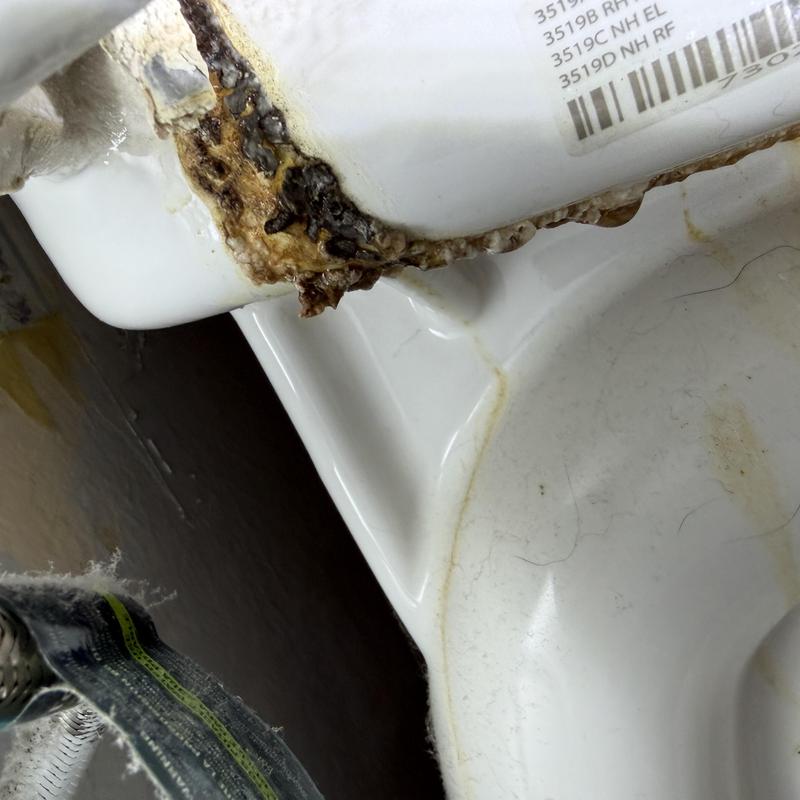 Toilet base with rust and corrosion damage close-up Toilet base with rust and corrosion damage close-up
