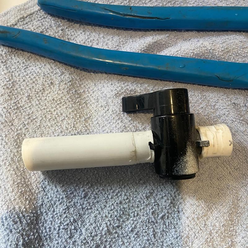 PVC ball valve with attached piping on towel