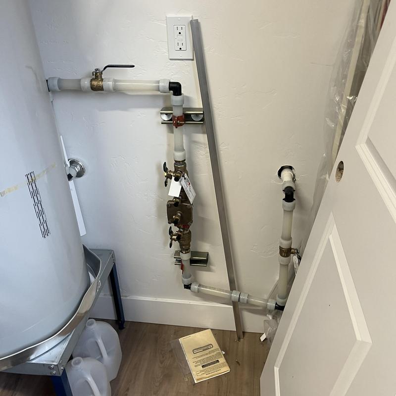 Backflow assembly with piping and shutoff valves
