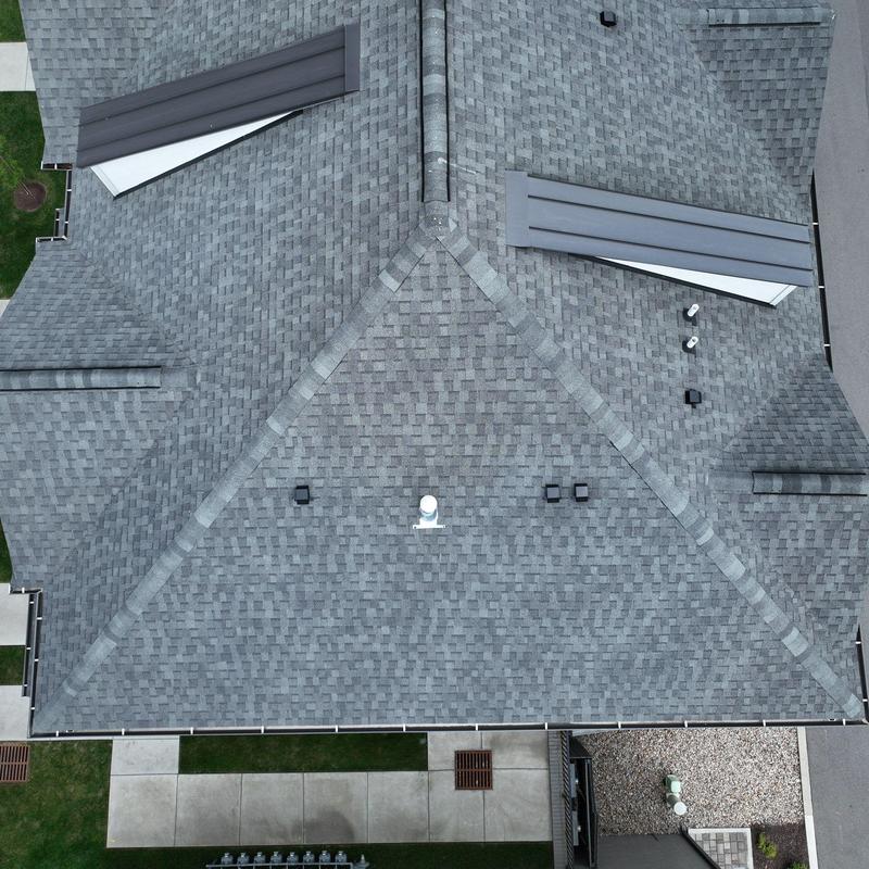 Asphalt shingle roof with vents and ridges inspection