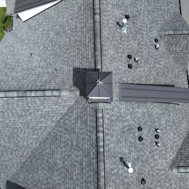 Asphalt shingle roof with hail damage inspection