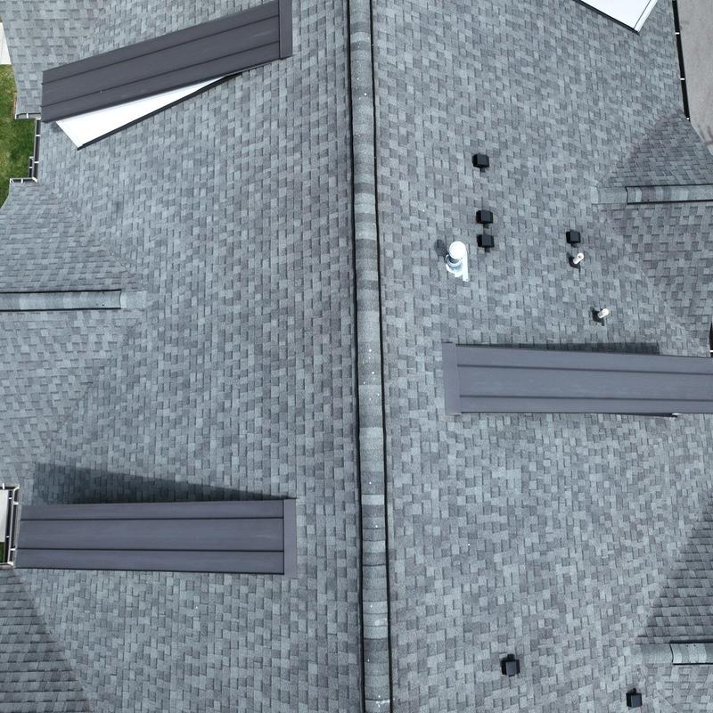 Asphalt shingle roof with vents and ridge cap