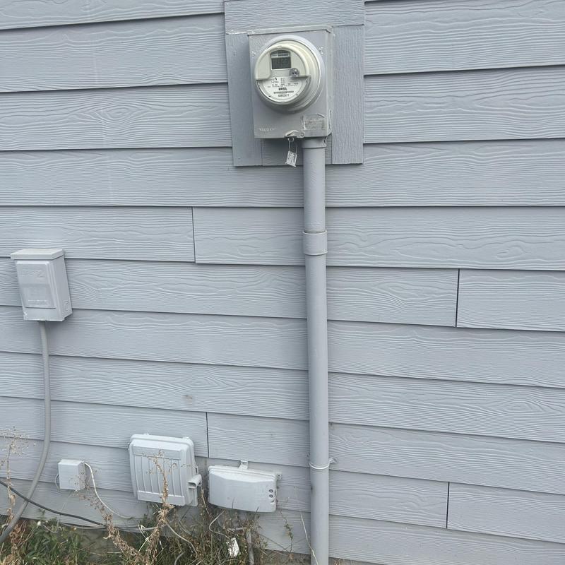 Electrical meter and exterior receptacles on house siding