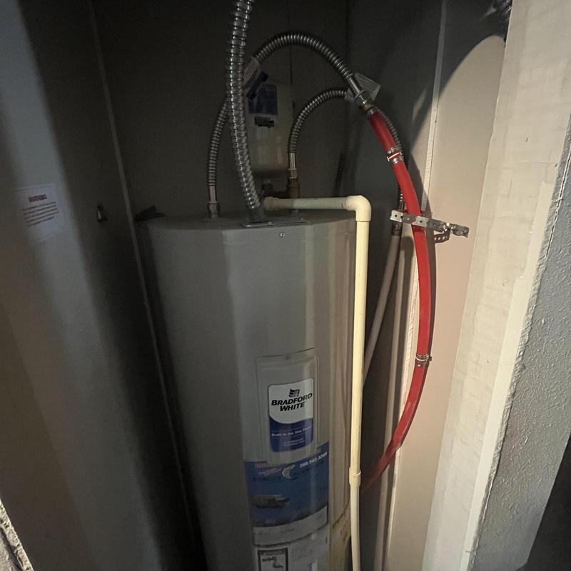 Water heater with red flexible water line installation