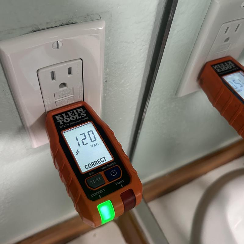 GFCI outlet with voltage tester reading 120 VAC GFCI outlet with voltage tester reading 120 VAC