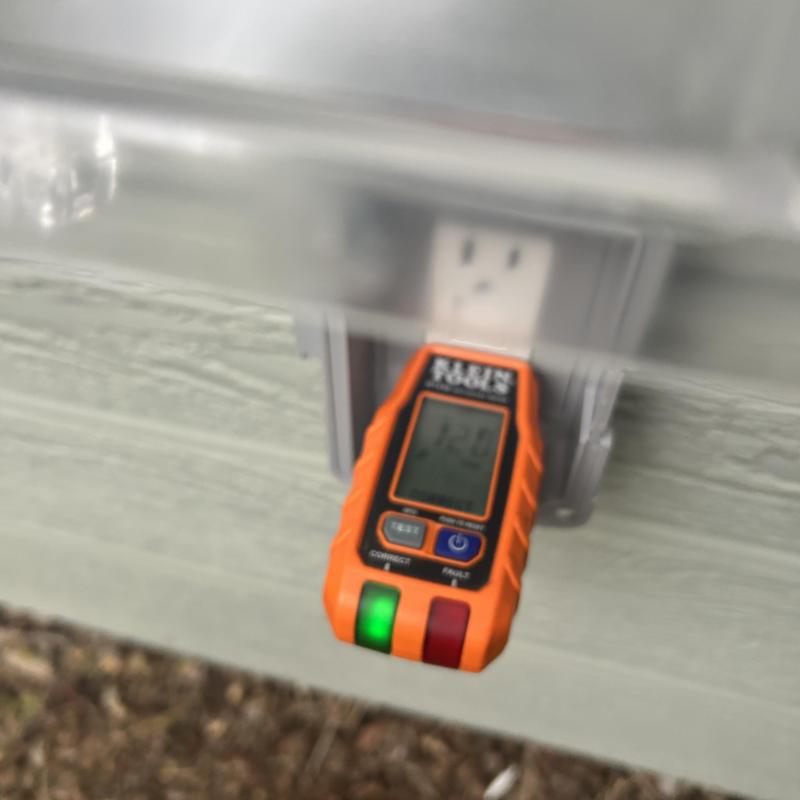 GFCI receptacle tester plugged in outdoor outlet GFCI receptacle tester plugged in outdoor outlet