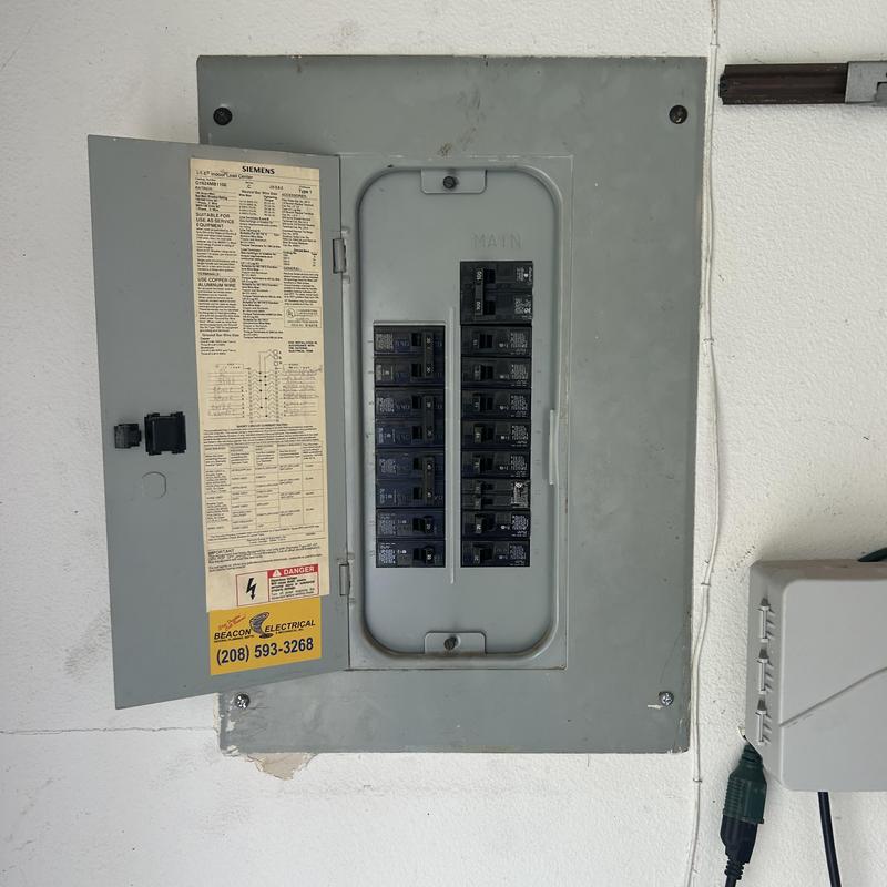 Electrical breaker panel with open circuit breaker door Electrical breaker panel with open circuit breaker door